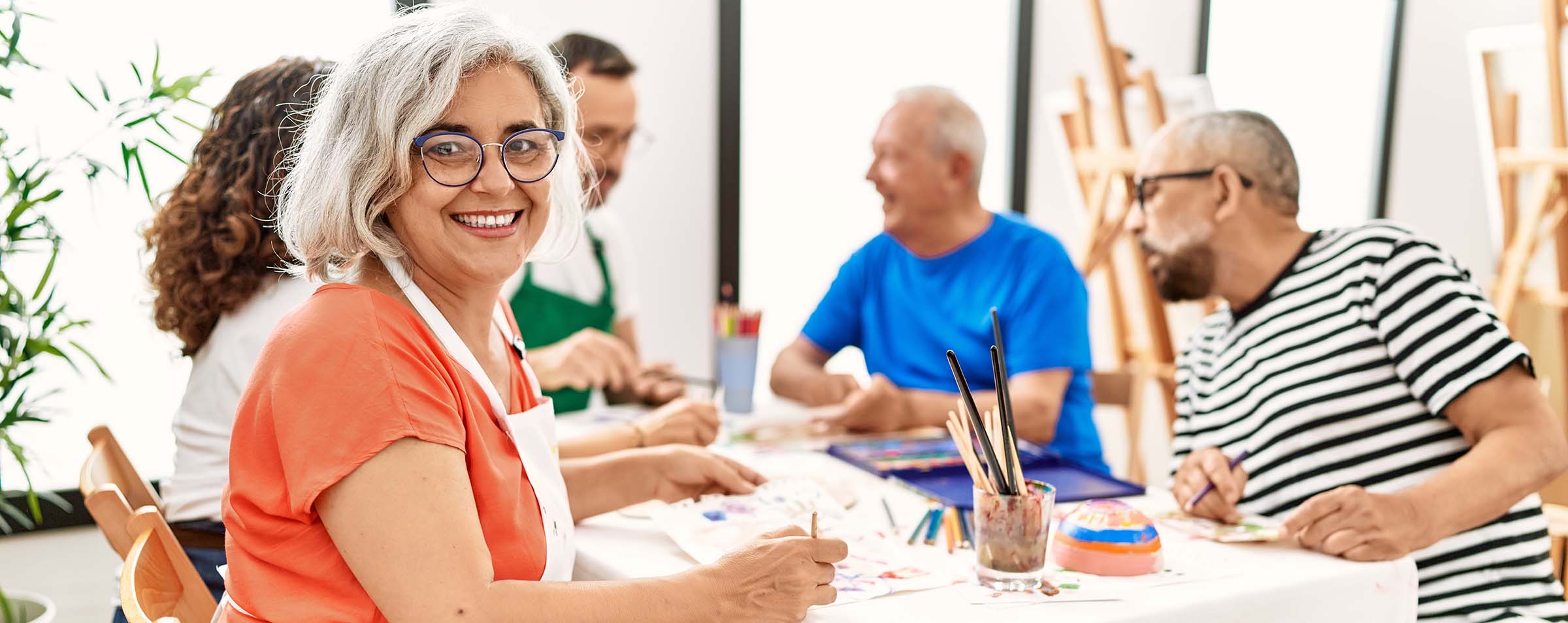 Woman painting with friends