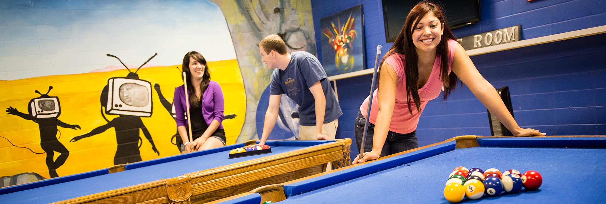 Students playing pool